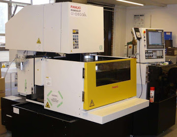 Photograph of one of our wire electro-discharge machines (wire EDM or wEDM).