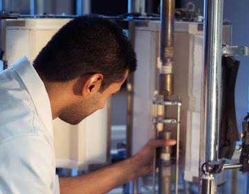 Photograph of one of our experts setting up a creep testing experiment.