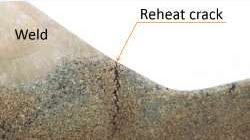 Macrograph of a reheat crack near a weld in 316H stainless steel.